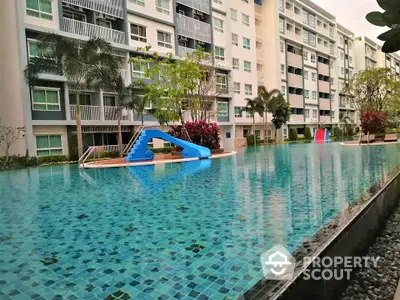 Luxurious condominium with stunning pool and lush landscaping