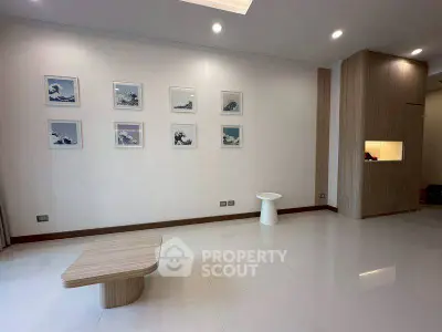 Minimalist living room with modern decor and sleek wooden furniture