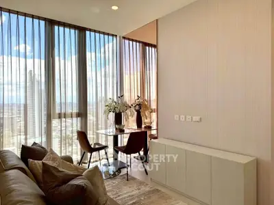 Modern living room with floor-to-ceiling windows and stunning city view