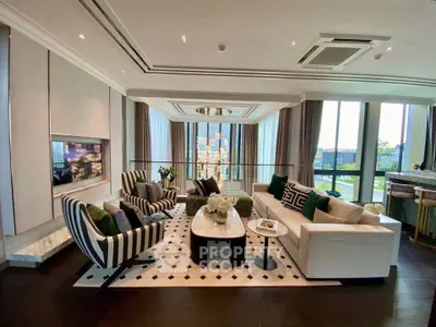 Luxurious living room with elegant decor and large windows offering stunning views.