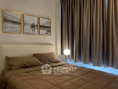 Cozy bedroom with elegant decor and soft lighting, perfect for relaxation.