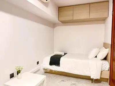Cozy minimalist bedroom with single bed and modern decor