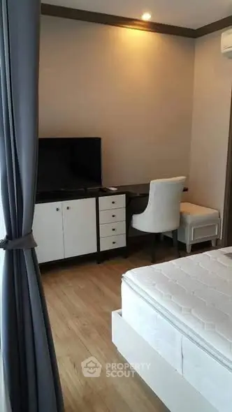 Modern bedroom with sleek furniture and natural light