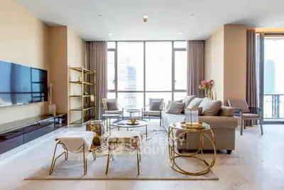 Luxurious modern living room with elegant decor and city view, featuring stylish furniture and large windows.
