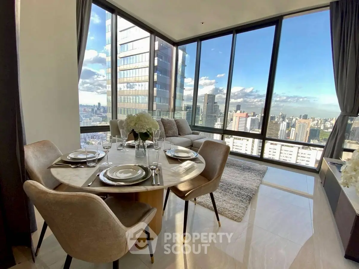 Luxurious corner unit with stunning city view and elegant dining area