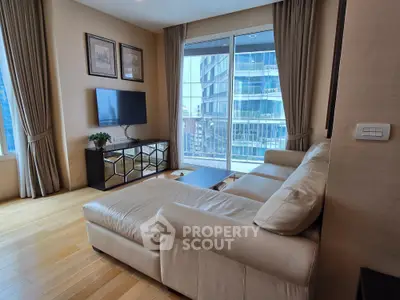 Luxurious living room with modern decor and city view balcony