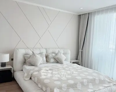 Elegant bedroom with modern decor and natural light