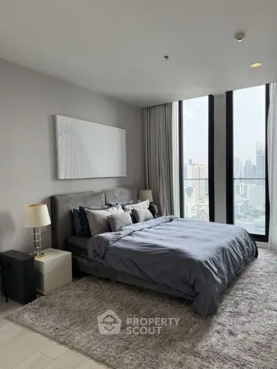 Luxurious bedroom with stunning city view and modern decor