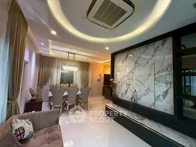Luxurious living room with elegant dining area and modern marble accents.