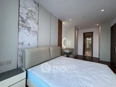 Spacious modern bedroom with elegant decor and natural light