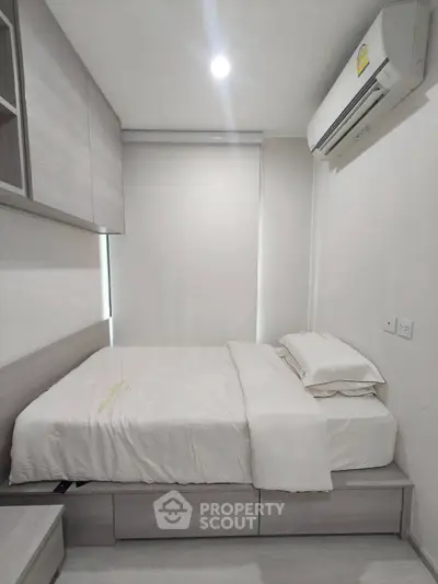 Modern minimalist bedroom with sleek design and built-in storage solutions