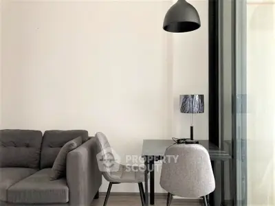 Modern living room with stylish furniture and sleek lighting, perfect for urban living.