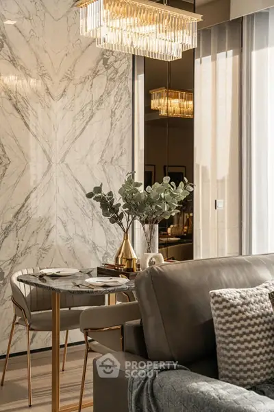 Luxurious living room with elegant marble wall and chic chandelier