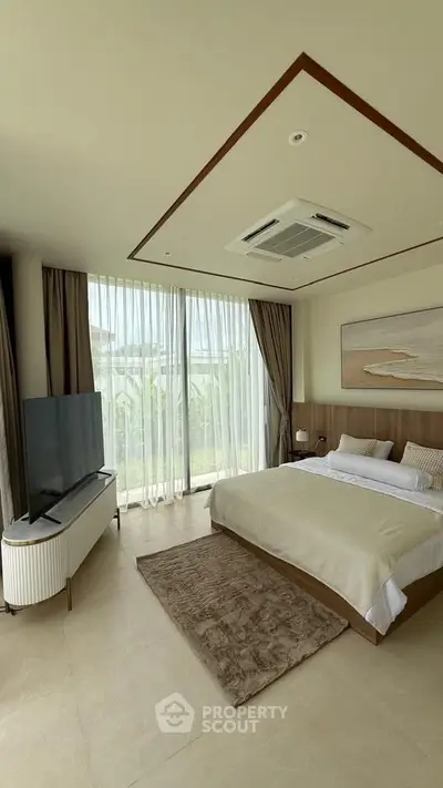 Luxurious bedroom with large windows and modern decor, featuring a cozy bed and sleek TV setup.