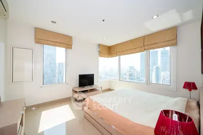 Bright and spacious bedroom with city view and modern decor