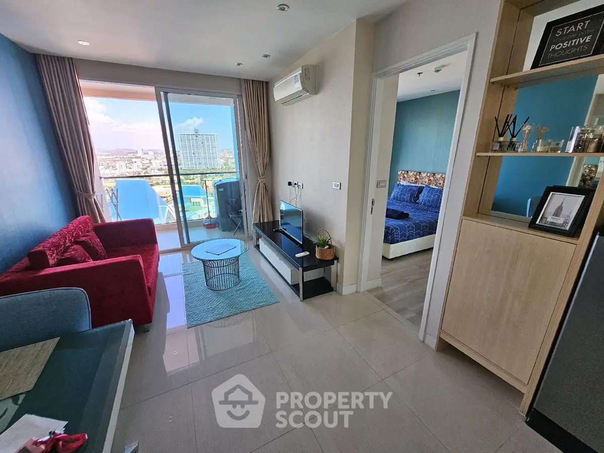 Modern apartment with stunning city view, featuring cozy living room and stylish bedroom.