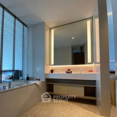 Luxurious modern bathroom with elegant lighting and spacious design.