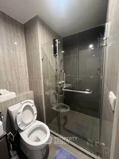 Modern bathroom with glass shower and sleek tile design