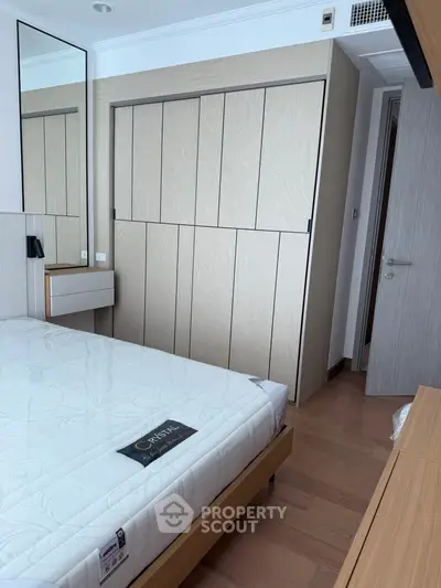 Modern bedroom with sleek wardrobe and stylish decor