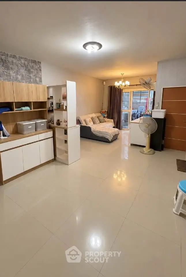 Spacious living room with modern decor and open layout, perfect for relaxation and entertaining.