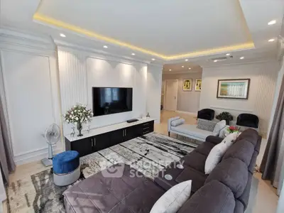Luxurious living room with modern decor, plush seating, and ambient lighting, perfect for relaxation and entertainment.