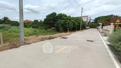 Scenic residential street with lush greenery and modern infrastructure