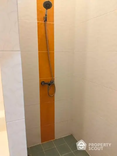 Modern shower area with sleek tile design in contemporary bathroom