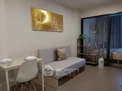 Modern living room with stylish decor and cozy seating area in a contemporary apartment.