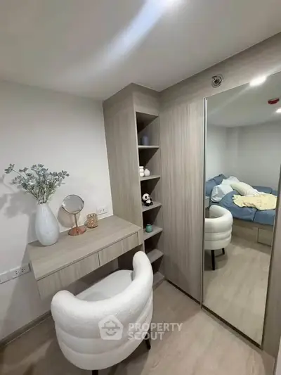 Modern bedroom with stylish vanity and cozy decor