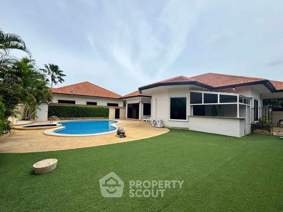 Luxurious villa with private pool and lush garden in serene neighborhood