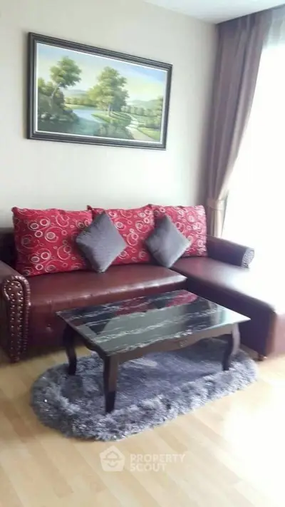 Cozy living room with elegant sofa and stylish decor, perfect for relaxation and entertaining guests.