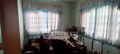 Cozy study room with natural light and comfortable seating