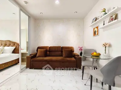 Modern living room with elegant marble flooring and cozy brown sofa, adjacent to a stylish dining area.