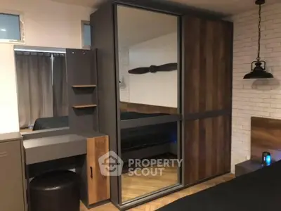 Modern bedroom with mirrored wardrobe and stylish decor