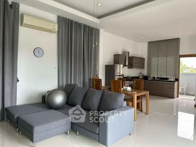 Spacious modern living room with open kitchen and stylish furniture