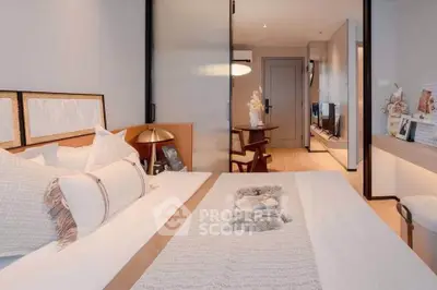 Luxurious bedroom with modern decor and cozy ambiance in a stylish apartment.