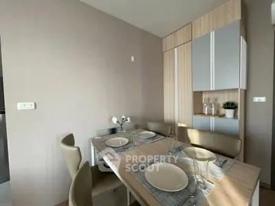 Modern dining area with elegant table setting and stylish decor