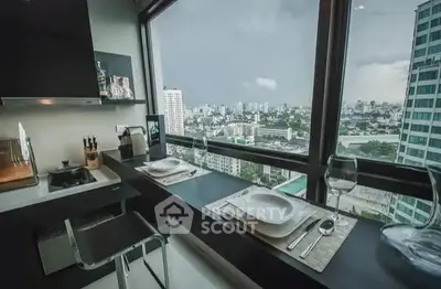 Modern kitchen with panoramic city view and sleek dining setup