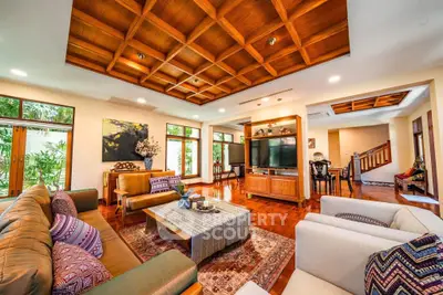 Luxurious living room with wooden ceiling and elegant decor