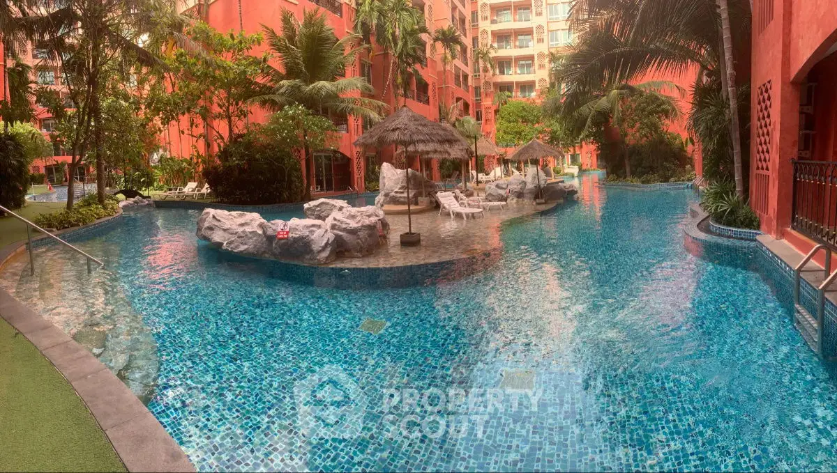 Luxurious tropical pool area with lush greenery and resort-style amenities.
