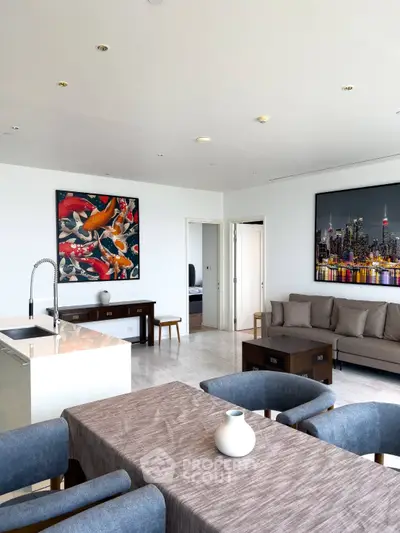 Spacious modern living room with elegant decor and open kitchen layout