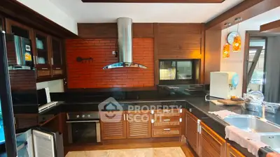 Luxurious kitchen with modern appliances and elegant wooden cabinetry
