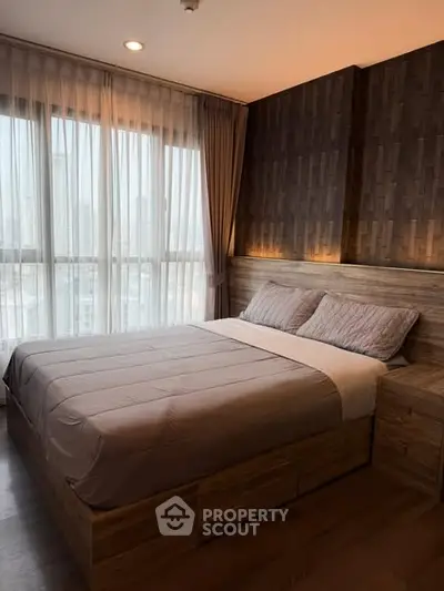 Modern bedroom with large windows and stylish wood paneling