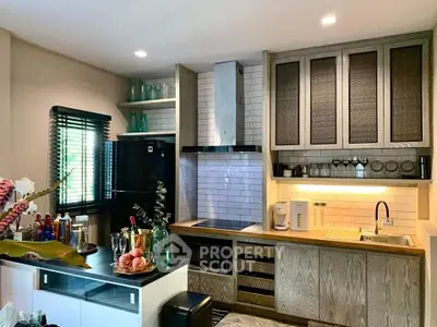 Modern kitchen with sleek cabinetry and built-in appliances, featuring a stylish open layout.