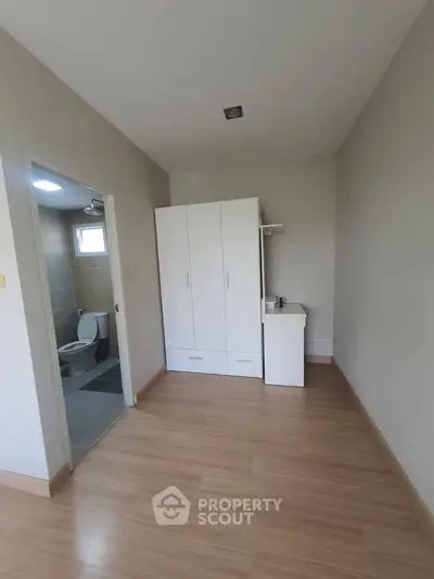 Spacious bedroom with ensuite bathroom and modern wardrobe