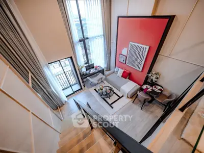 Luxurious modern living room with high ceilings and balcony view