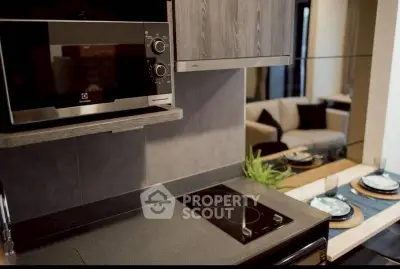 Modern kitchen with sleek appliances and elegant dining setup