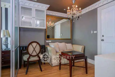 Elegant living room with chandelier and classic furniture in a stylish apartment.