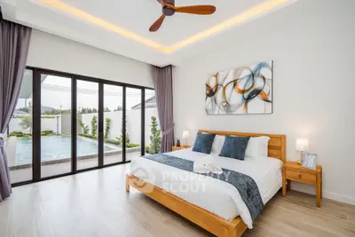 Luxurious bedroom with pool view, modern decor, and elegant lighting in a serene setting.