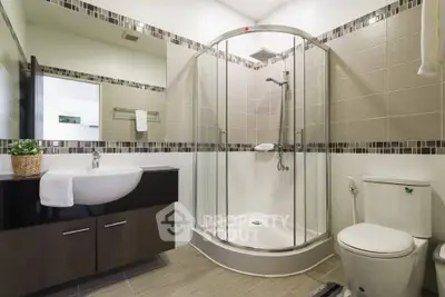 Modern bathroom with glass shower and stylish vanity